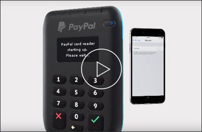 Video still of a PayPal card reader and smart phone.