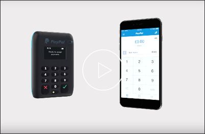 Video still of a PayPal card reader and smart phone.