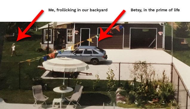 A snapshot of Betsy, the Pontiac Acadia, in a driveway