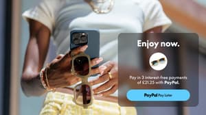 Shopper holding sunglasses and a mobile phone with a PayPal Pay Later message showing Pay in 3 interest-free payments.