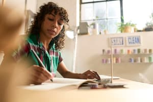 Business owner reviews accounts receivable and accounts payable. 