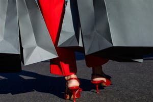 Person walking with red heals