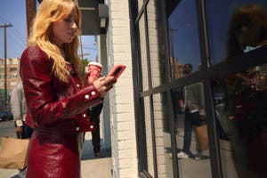 Consumer uses phone to do AI-powered holiday shopping.