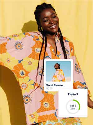 A person smiles while wearing a new floral jacket. Next to the photo is an in-app example showing the Pay in 3 option.