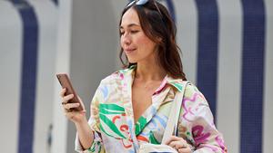 Woman looks at her smartphone
