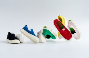 Photograph of eight La Cariuma slip on sneakers in black, white, blue, grey, green, yellow, red and pink