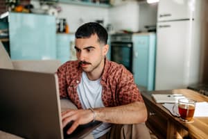 A customer uses a global payment platform on their laptop to make a purchase.