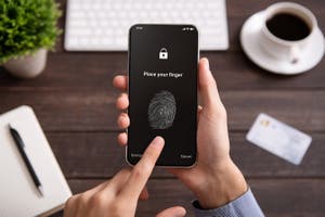 A phone asks for a fingerprint ID passkey to unlock a phone.