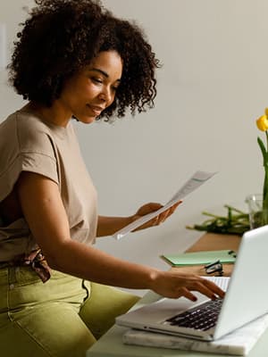 Animation of woman at laptop with overlay of credit card checkout fields switching to man in warehouse with overlay of a payment optimization chart
