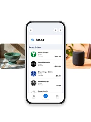 Telefonens brugergrænseflade med seneste betalingsaktivitet og felter med billeder, der inkluderer et hus, en keramisk skål, en højttaler og hovedtelefoner
