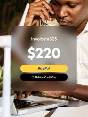 Person working on computer while talking on phone with an overlay of Invoice #325 for $220 with PayPal button and Credit Card button