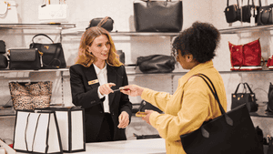 A woman making a payment in a department store.
