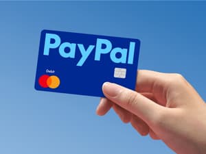 Hand holding PayPal Debit Card