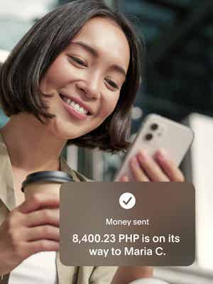 Woman sending money to the Philippines