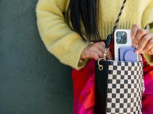 Person pulling phone out of bag