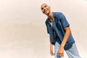 Young man in a blue shirt and jeans