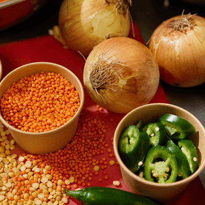 White onions, green peppers, and orange seeds.