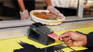 Person paying at a food truck