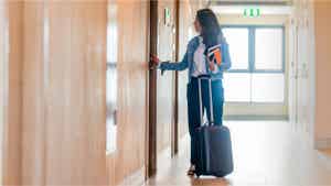 Woman entering a hotel room