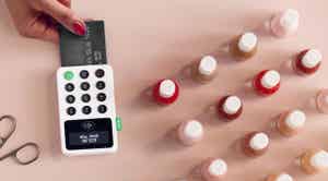 Person paying at a nail salon