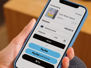 Telefonbildschirm mit gelbem PayPal-Button über gelbem Später Bezahlen-Button an der Kasse