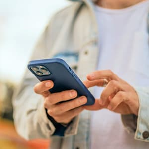 Person using a phone outdoors