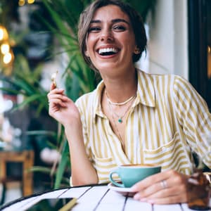 Person having coffee and smiling