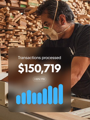 Carpenter working in shop with overlay showing a bar graph and $150,719 transactions processed