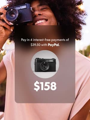 Man smiling and taking a photo with an overlay of 4 interest-free payments of S158