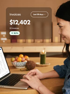 Woman working on laptop with invoice overlay showing $12,402 received over 22 invoices in the last 30 days