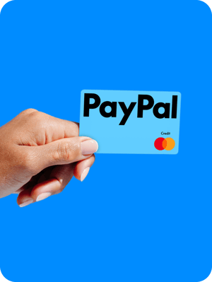 Person holding a New PayPal credit card.