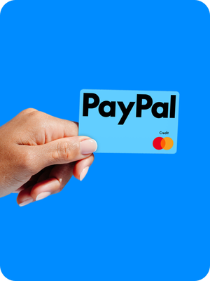 Person holding a New PayPal credit card.