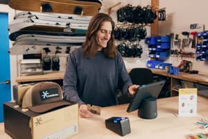 Skateboard business owner adjusts retail media on his POS screen.